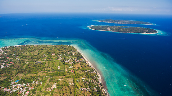 Aerial drone photo of Gili Islands with incredible diversity of marine life, from migrating whales to colourful intertidal creatures offers a truly unforgettable experience during vacations holidays