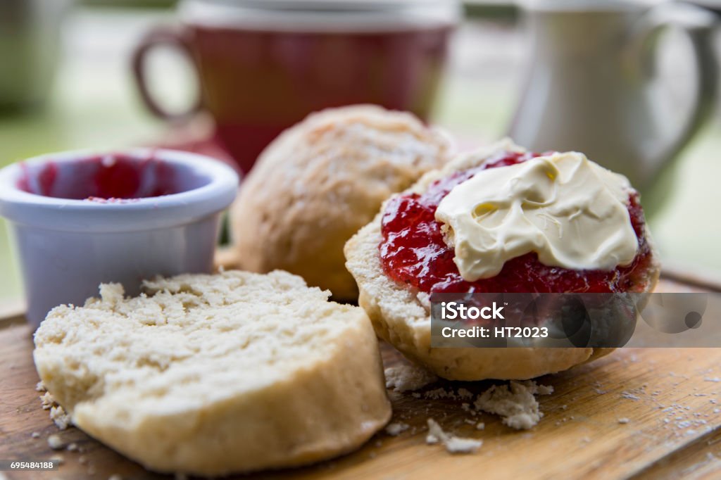 English Cream tea with scones jam and cream English Cream tea with scones jam and clotted cream and cup of tea Scone Stock Photo