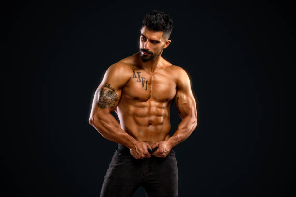 istock Handsome Shirtless Men in Jeans 695484300