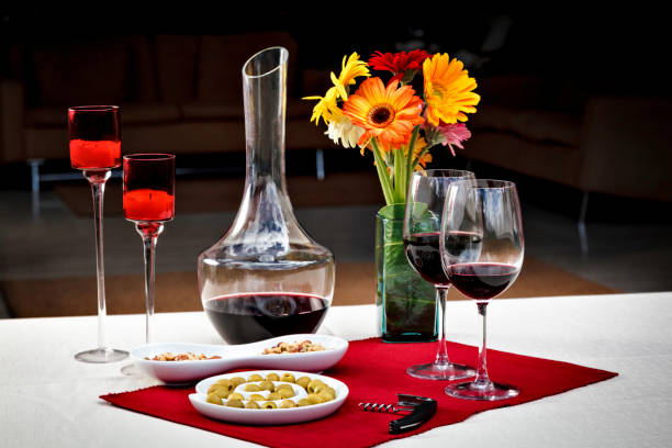 istock Wine peanut appetizers on lovely table setting  at home garden 695485522