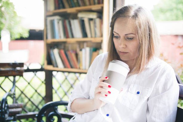 istock Young woman relax with reading a book 695488408