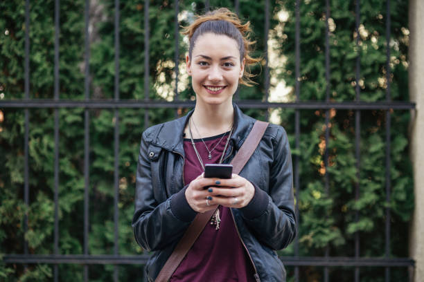 istock Beautiful city girl looking at camera 695491880