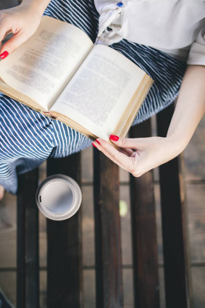 Young woman relax with reading a book , Outdoor lifestyle&vintage tone picture