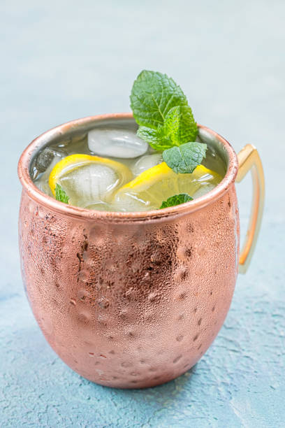 istock Moscow Mule cocktail with ginger beer, vodka and lemon 695496036