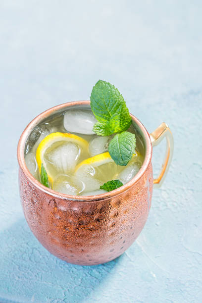 istock Moscow Mule cocktail with ginger beer, vodka and lemon 695496084