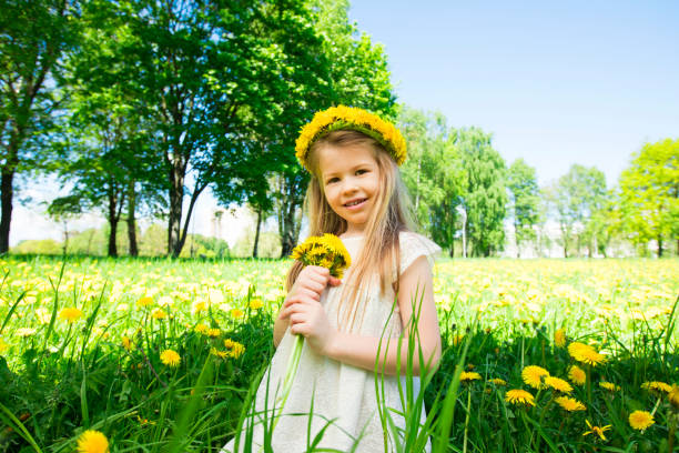 istock Girl with floral head wreath and bunch 695498802