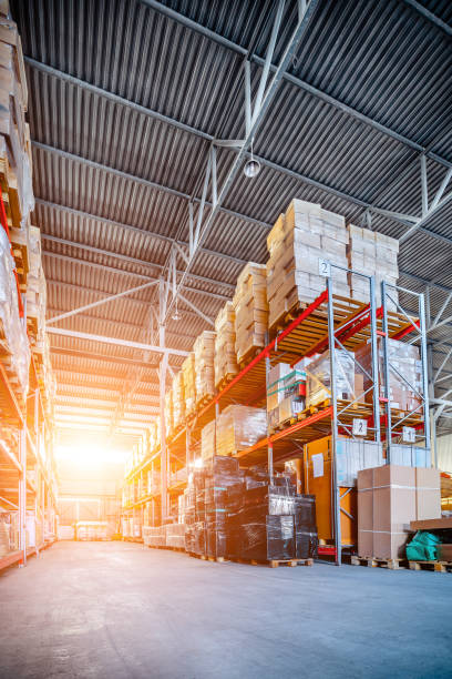 istock Long shelves with a variety of boxes and containers 695499216