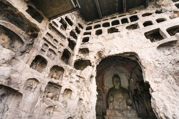 Luoyang: Middle Binyang Cave with sculptures in Longmen Grottoes (Longmen Caves). The complex was inscribed upon the UNESCO World Heritage List in 2000