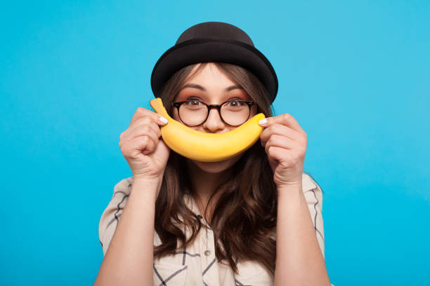 istock Cheerful girl posing with banana 695506266