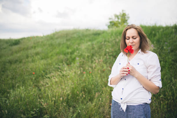 Young woman in poppies
