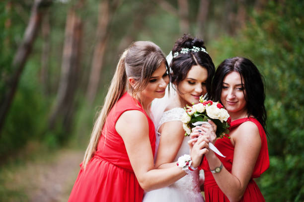 istock Fantastic bride with awesome bridesmaids having fun in the forest on a wedding day. 695524122