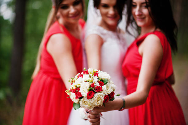 istock Fantastic bride with awesome bridesmaids having fun in the forest on a wedding day. 695524284