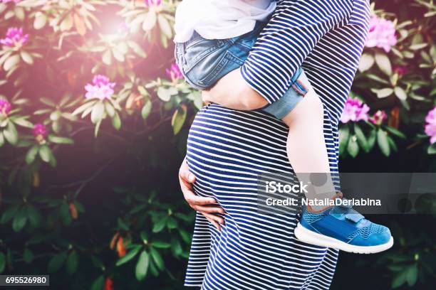 Pregnant Woman With Child Stock Photo - Download Image Now - Pregnant, Mother, Child