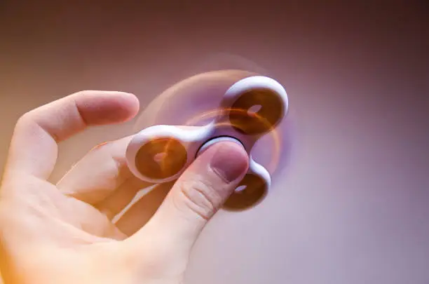 Motion blur and glow amazing fidget spinner closeup