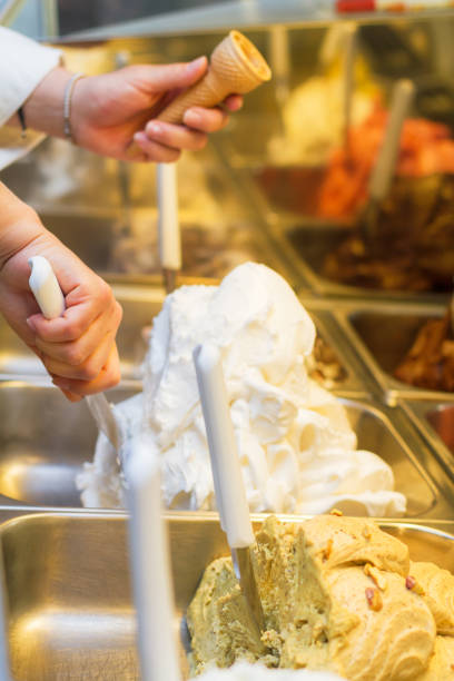 istock Woman preparing an ice cream cone 695530734