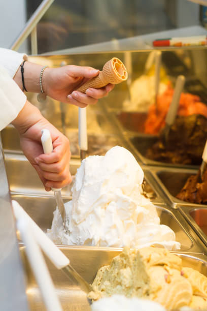 istock Woman preparing an ice cream cone 695530770