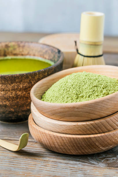 istock Board a bowl of tea Green Tea 695530784