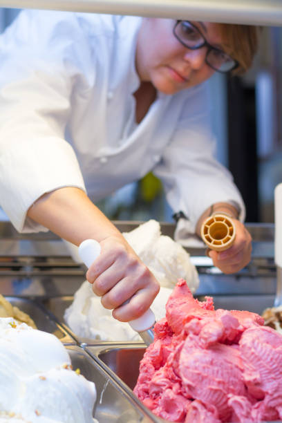 istock Woman preparing an ice cream cone 695530814