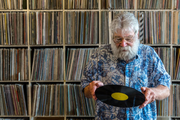 istock Record collector in front of his collection 695531130