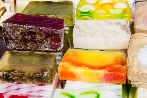 istock Stack of different natural handmade soaps on retail market 695531488