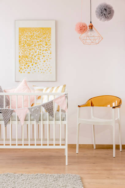 istock Poster over cozy nursery crib 695533920