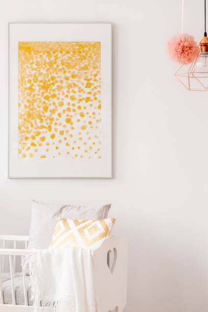 istock Framed poster over baby cradle 695533924