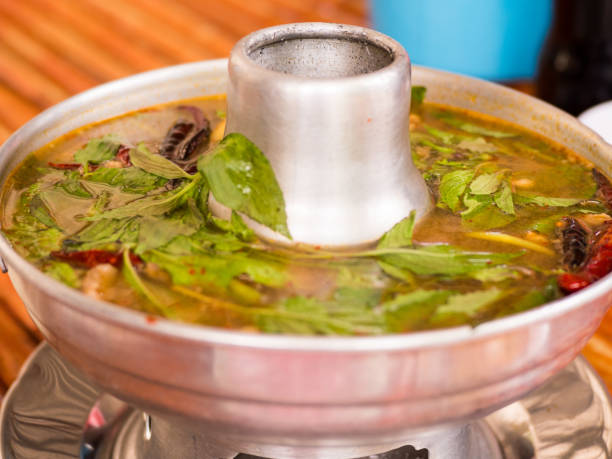 istock hot and spicy pork rib hot pot with Thai herbs. 695535254