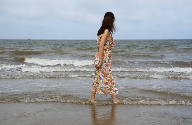 istock Young girl on the beach 695538090