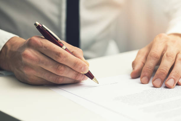 istock businessman signing business partnership contract 695539026