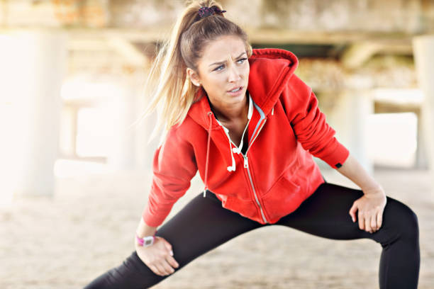 istock Woman jogging on the beach 695555048