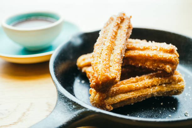 istock Sweet fried Churros donut with chocolate sauce 695555744