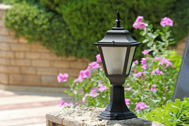 istock Small decorative street lamp in the yard 695558392
