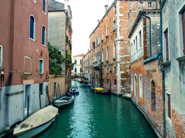 istock Canal with boats in venice 695561316