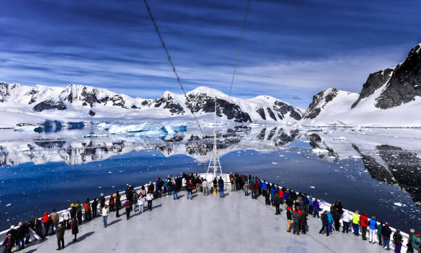 Sailing Passenger on the bow of a large passenger cruise ship along the coast of Antarctica antartica stock pictures, royalty-free photos & images