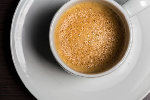 istock Espresso coffee close up on a white dish 695572842