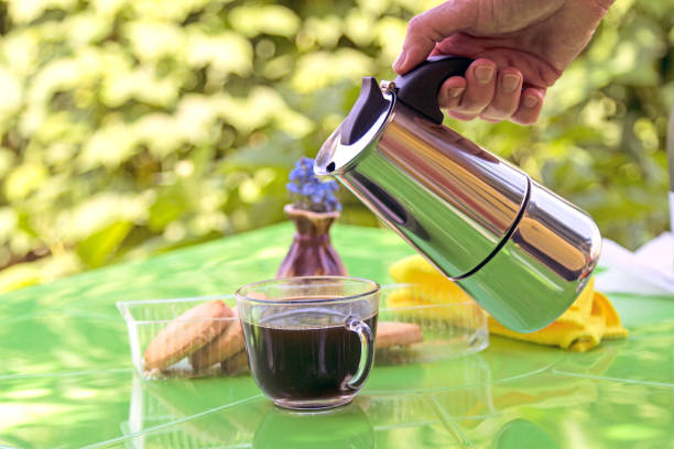 istock Black coffee in the garden 695574300