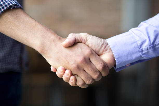 Closeup of Two Business Men Shaking Hands stock photo