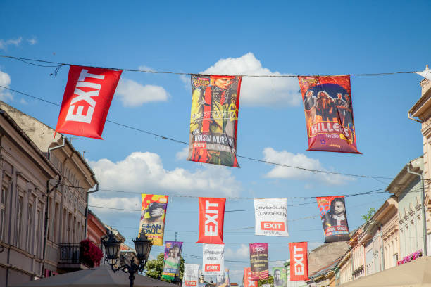 Banners and flag in Novi Sad (Serbia) main streets announcing the upcoming Exit festival, held every year in the city, one of the biggest music festival in Balkans Pictures of flags promoting Exit Festival, one of the most famous festivals in Central and Southeastern Europe, held every year in Petrovaradin fortress in Novi Sad, second city of Serbia exit festival stock pictures, royalty-free photos & images