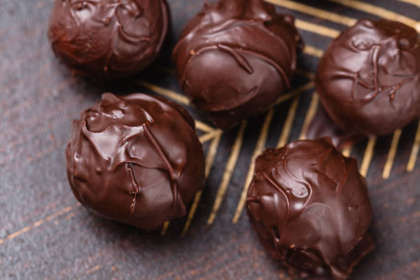 istock Closeup truffles in chocolate 695592532