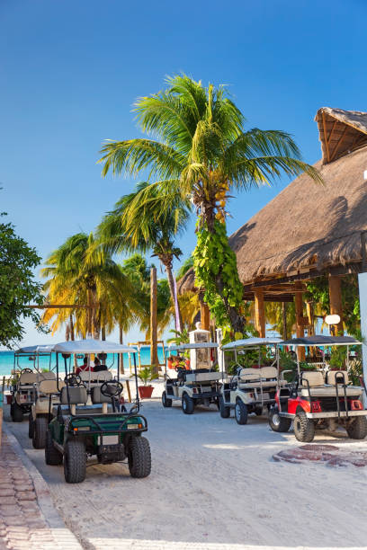 Golf carts in a raw Golf carts in a raw outside, nobody. Mexico, Cancun, Isla Mujeres isla mujeres stock pictures, royalty-free photos & images