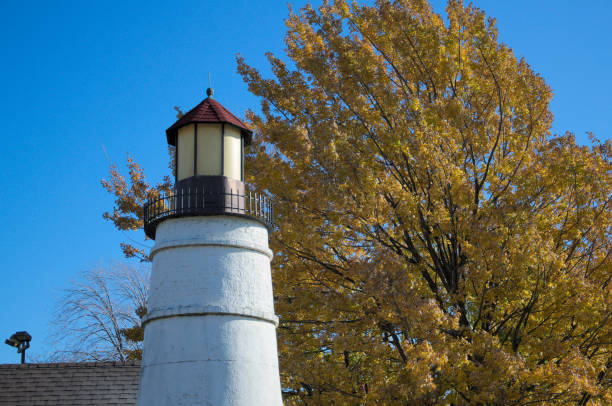 istock A small lighthouse presiding over a mini golf course, closed for the season. 695593376