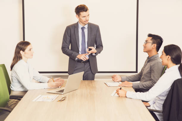 istock Serious businessman holding meeting with team 695593616