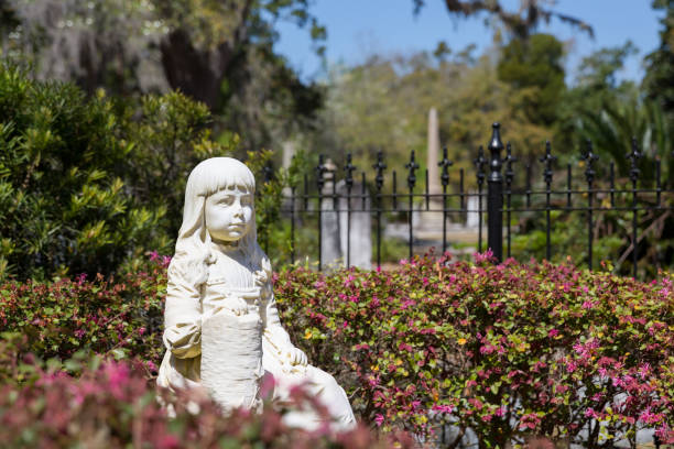 istock Little Gracie Statue in Bonaventure Cemetery 695596260