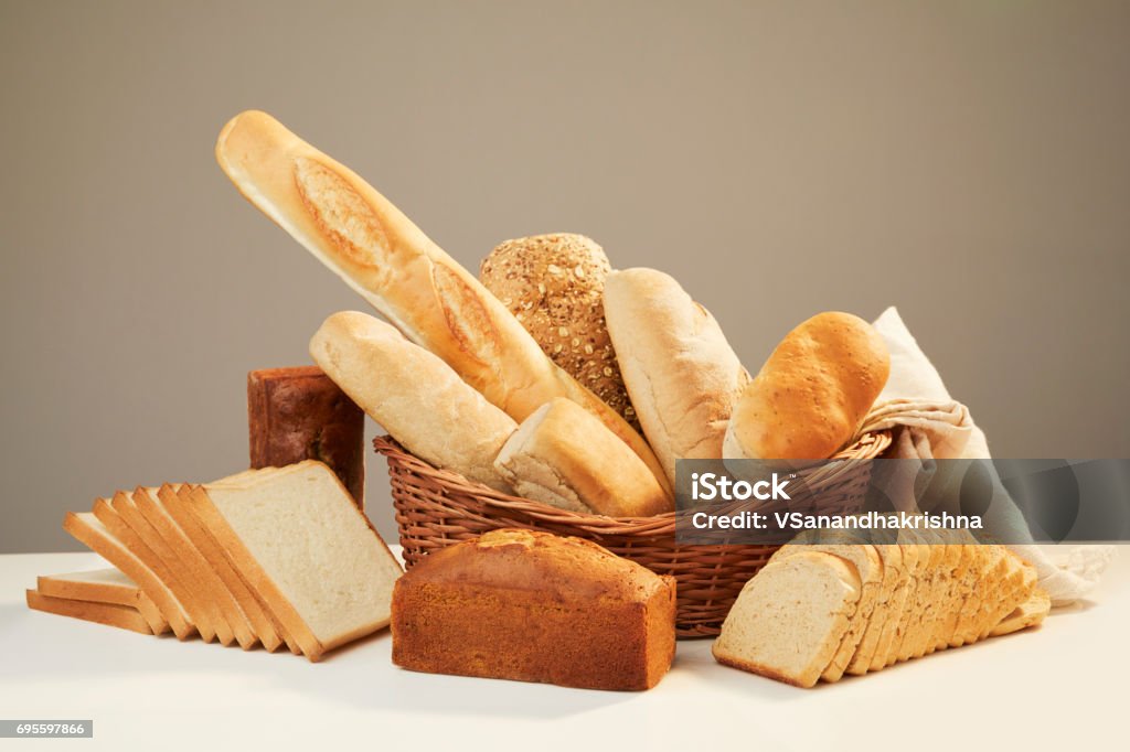 Basket with assorted baking products Basket with assorted baking products in studio shot. Bread Stock Photo