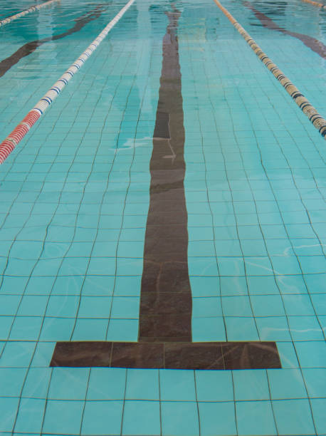 istock swimming pool with clear blue water 695603394