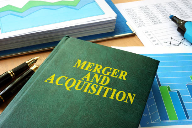 istock Book with title Merger and Acquisition M&A. 695603474