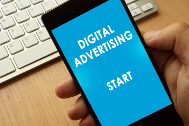istock Hands holding phone with page Digital advertising. 695603716