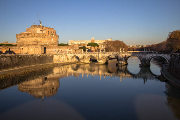 sant' angelo bridge and sant' angelo castel, rome - roman statue angel rome imagens e fotografias de stock