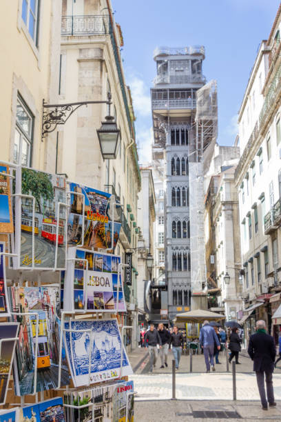 Postcards rack in Lisbon, Portugal Llisbon: Santa Justa elevator with postcards rack in the front in Lisbon, Portugal santa justa lift portugal stock pictures, royalty-free photos & images