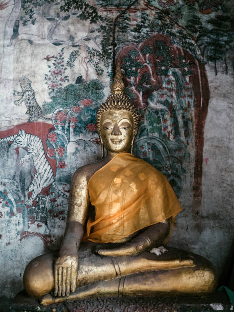 Wat Pa Huak temple in Luang Prabang Laos This is one of the oldest wooden temples in Luang Prabang.The murals of the XIX century depict historic and mythological scenes
